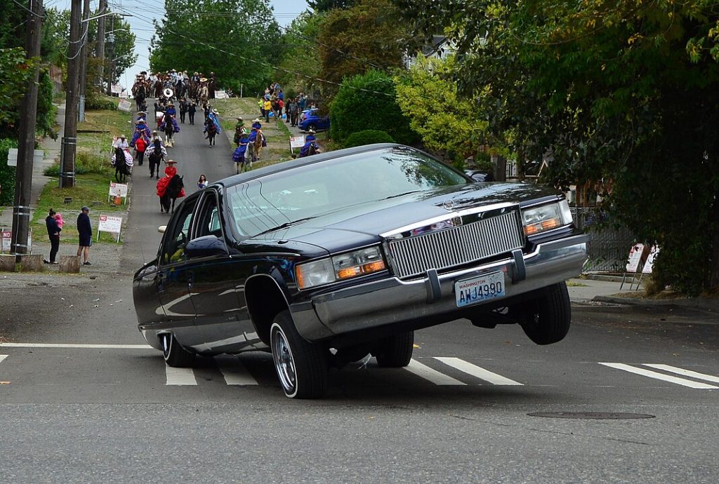 A 1994 Cadillac Fleetwood lowrider 3-wheeling